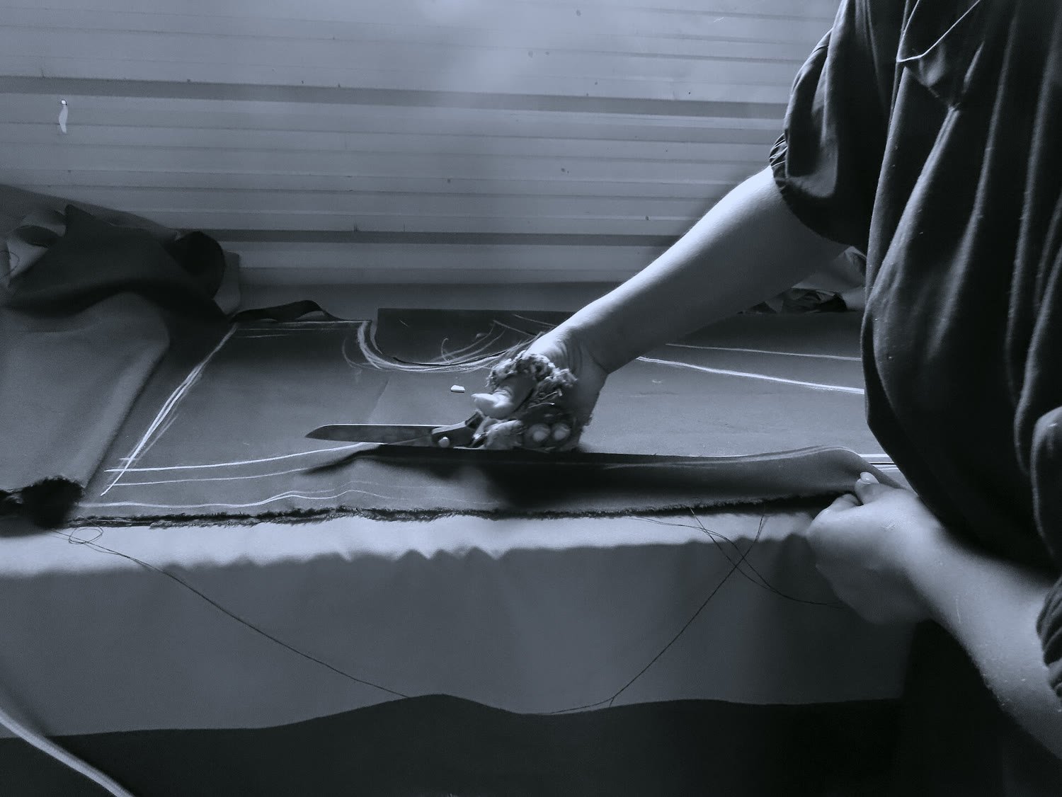Cutting cloth by hand